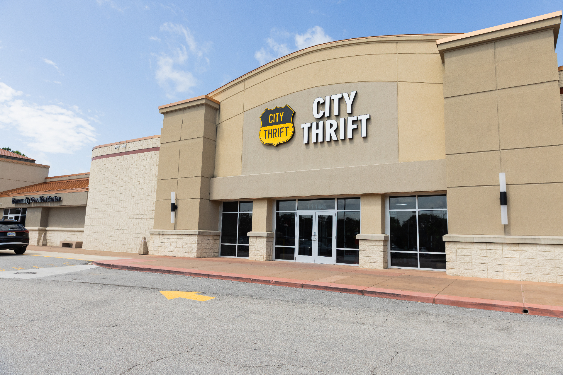 City Thrift Waldo storefront with prominent shield sign against a clear blue sky